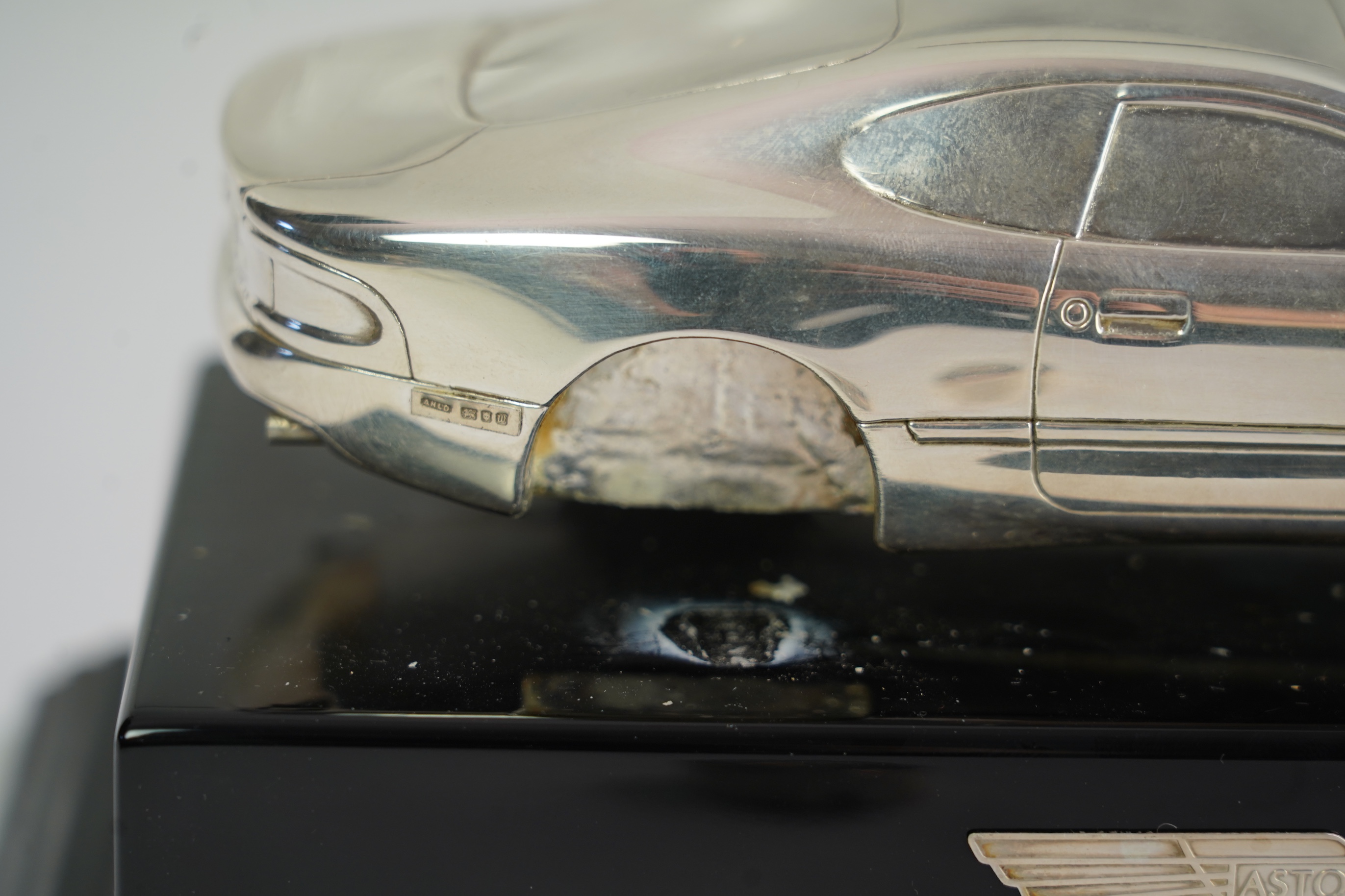 An Elizabeth II miniature silver model of an Aston Martin DB7 Vantage, by Aston Martin Lagonda Design Ltd